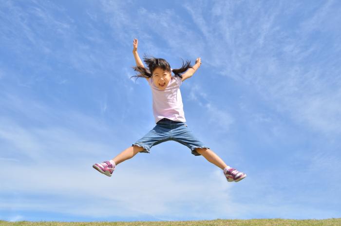 A girl leaping into the air