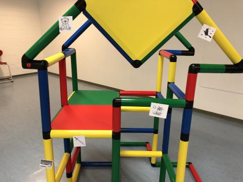 A QUADRO jungle gym with cards with pictures attached to it