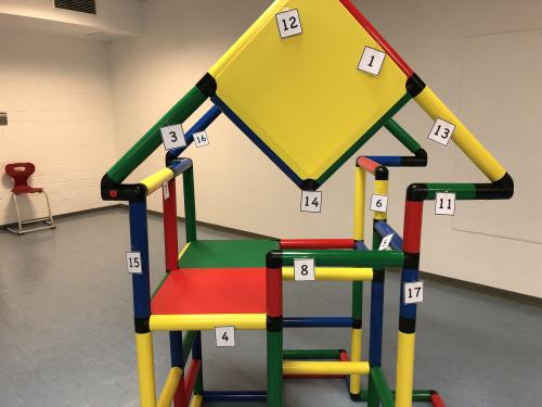 A QUADRO jungle gym with numbers attached to it