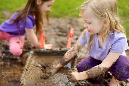 Girls playing in the mud