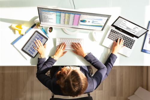 Woman multitasking at desk