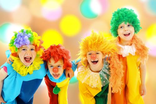 Children wearing clown costumes