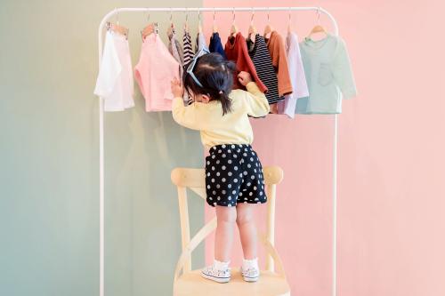 A girl picking out clothes