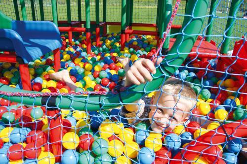 A child in a QUADRO ball pit
