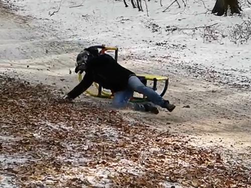 Rider falls off sled