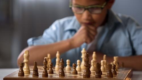 Boy playing chess