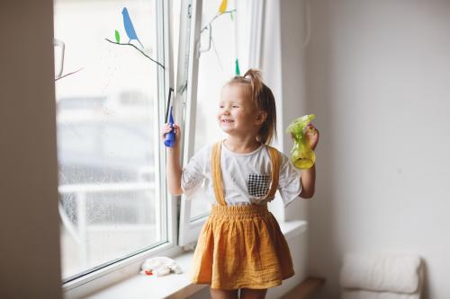 Girl cleaning a window