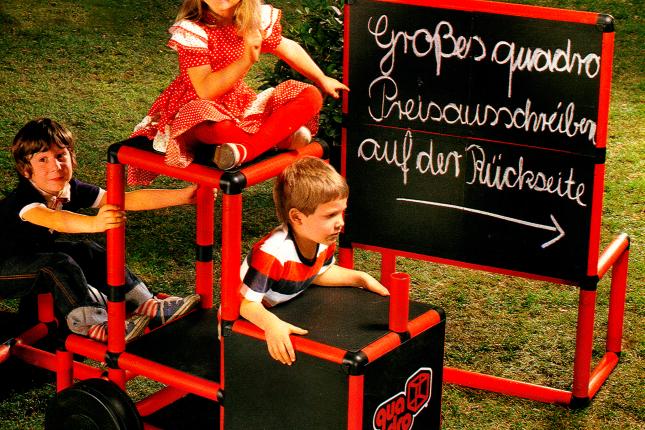 Children playing on an old QUADRO vehicle